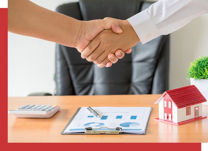 selling house shaking hands